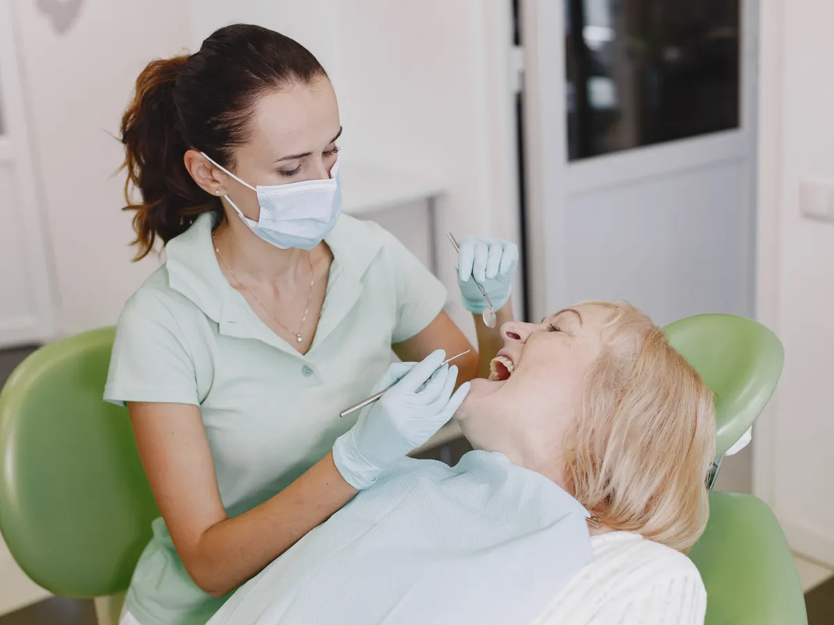Dentist examining a patient in a dental office
