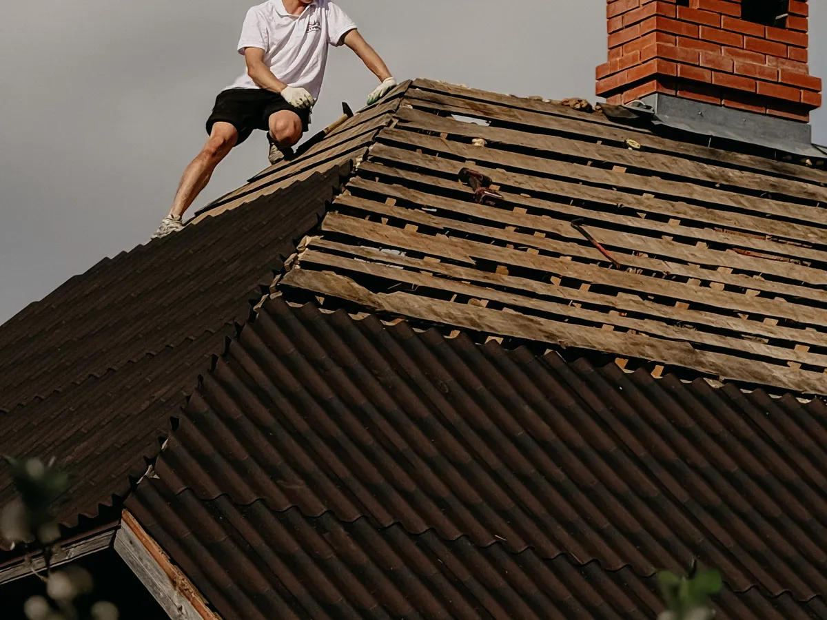 Roofer working on a sloped roof